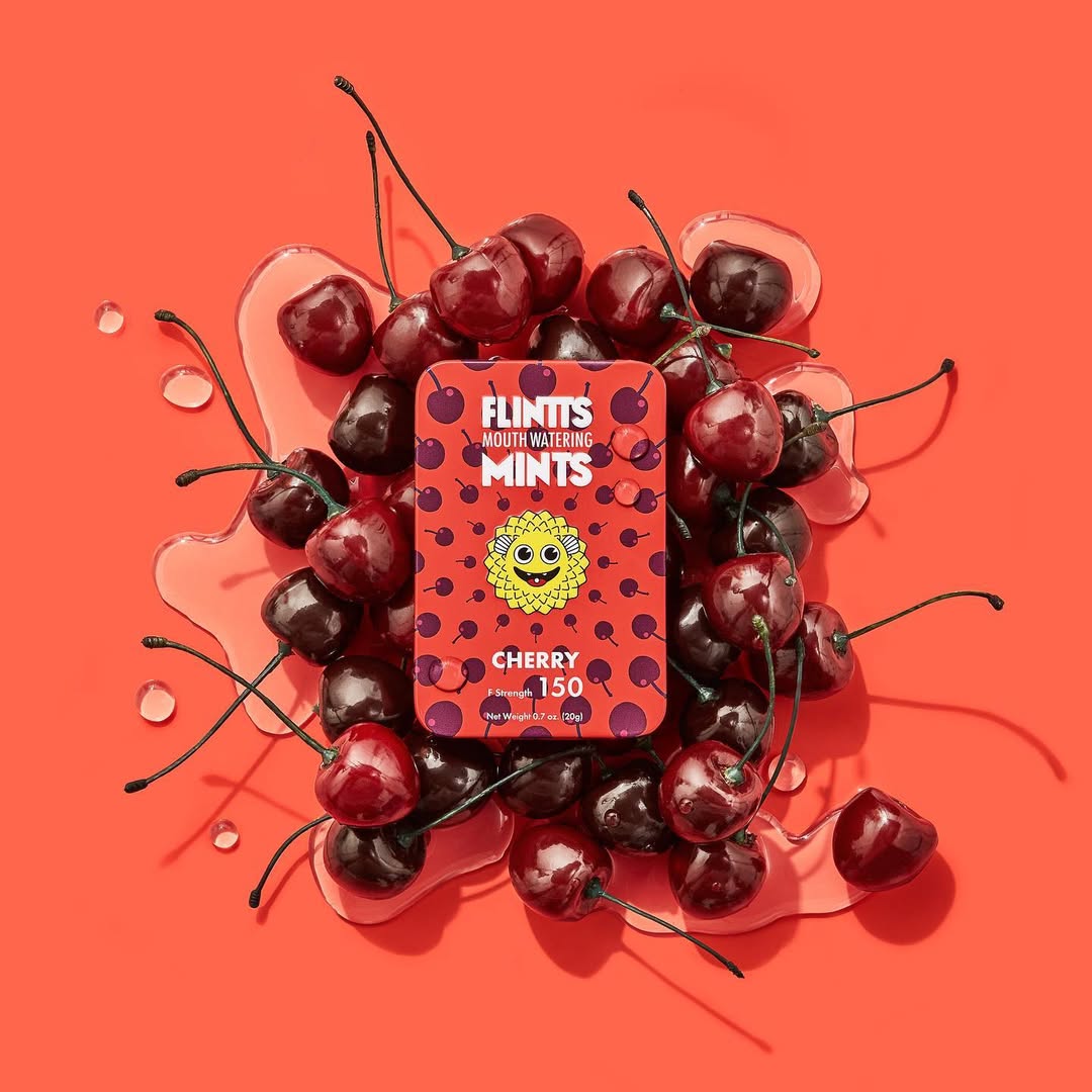 Flintts Mints Cherry F150 tin with cherries on a pink-red background – GetMints Australia